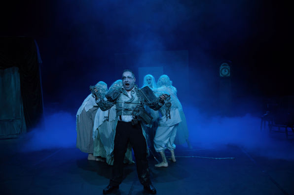 a male Actor on the main stage playing Joseph Marley form the musical Christmas Carrol