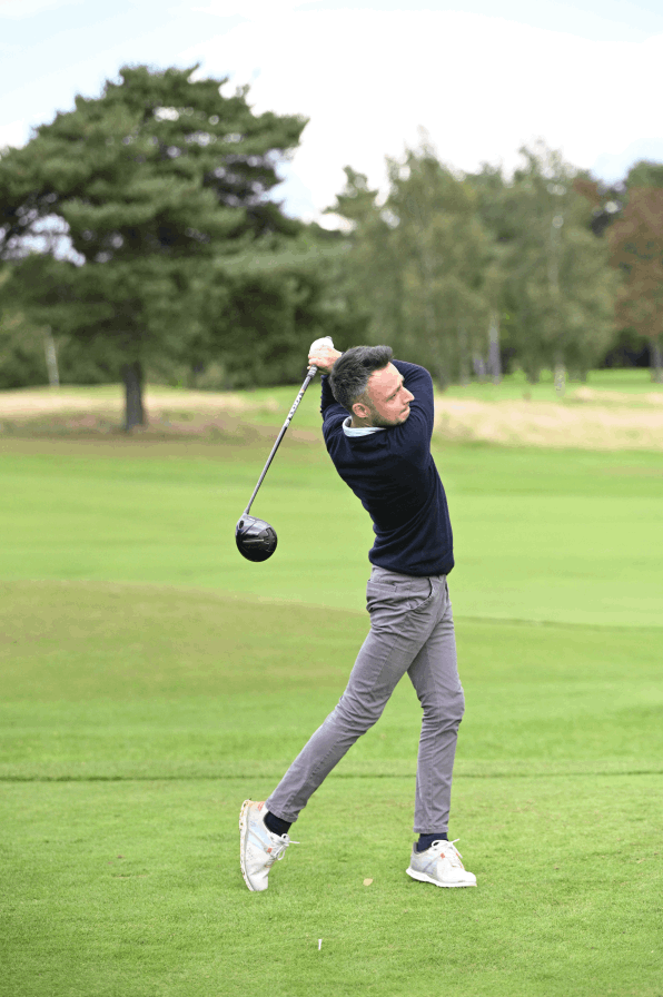 A man playing golf on a Corporate Golf day in stockport.