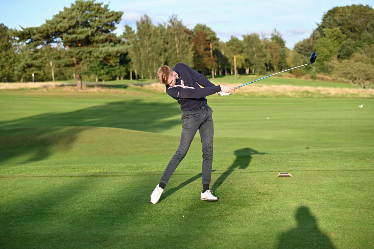 A man playing golf on a Corporate Golf day in stockport.